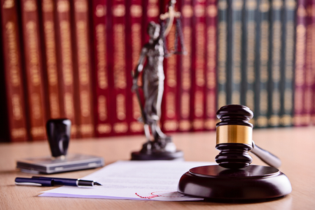 The composition of the gavel, statuette of goddess of justice Themis - with scales of justice, legal codes, stamps and pen. Law conceptの写真素材