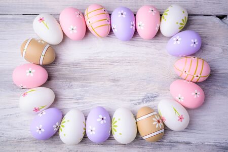 Painted colorful Easter eggs with copy space on grey wooden background Top view. Flat layEaster concept. Happy Easter !の写真素材