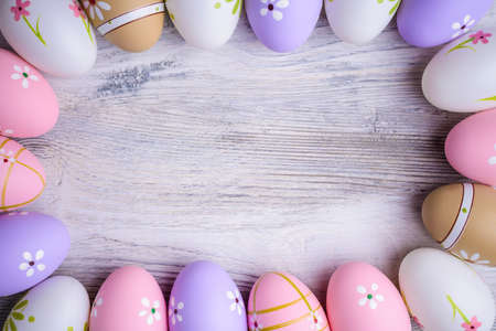 Painted colorful Easter eggs with copy space on grey wooden background Top view. Flat lay. Easter concept. Happy Easter !の写真素材
