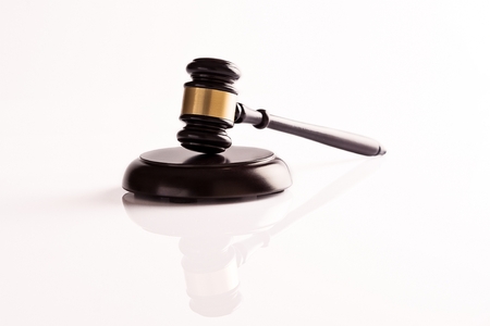 Judge's gavel on white background with reflectionの写真素材