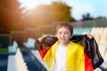 Little boy - Germany national football team fan - supporter on the stadiumの写真素材