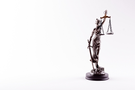 Themis - statuette of the Goddess of Justice isolated on white backgroundの写真素材