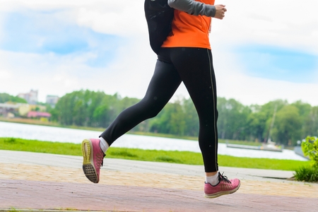 Woman running alone in park. Healthy lifestyleの写真素材