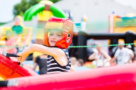 Kids playing - fighting in colorful playgroundの写真素材