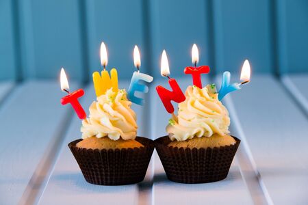 Birthday's cake - muffin with a candles for 20 - twentieth birthday . Happy birthday !の写真素材