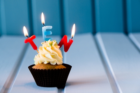 Birthday's cake - cupcake with a candles for 10 - tenth birthday . Happy birthday !の写真素材