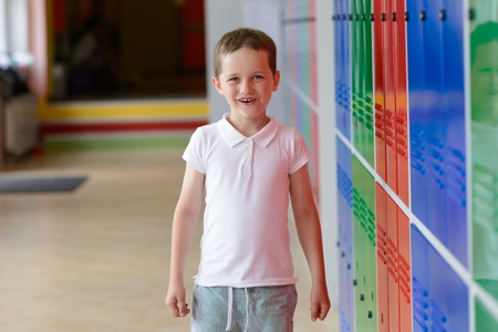 Happy 7 years old schoolboy at last day of school before vacations. End of school.の写真素材