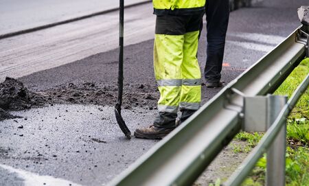 Summer road work. Road renewal. Traffic Jamの写真素材