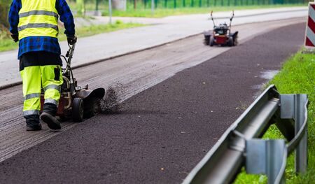 Summer road work. Road renewal. Traffic Jamの写真素材