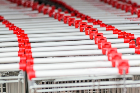 Empty shopping carts in big shopping centerの写真素材