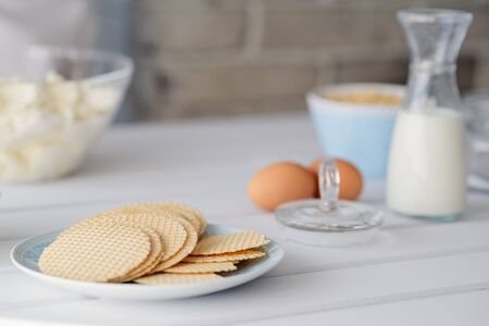 Healthy oat waffles on a plate in the kitchenの写真素材