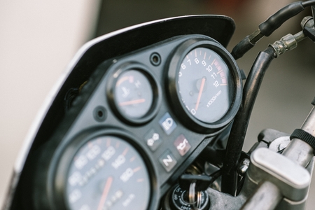 Classic motorbike control panel with speedometer and revs counterの写真素材