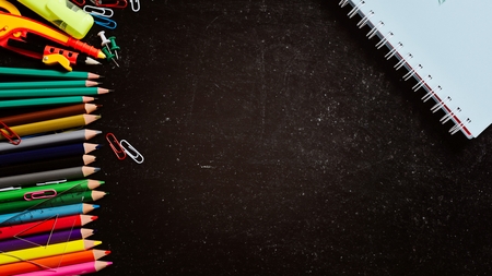 Back to school. Empty chalkboard with school accessoriesの写真素材