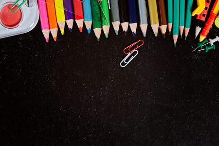 Back to school. Empty chalkboard with school accessoriesの写真素材
