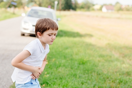 Seven years old child feeling bad - suffers from motion sicknessの写真素材
