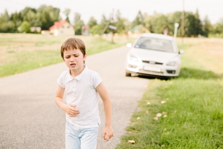 Seven years old child feeling bad - suffers from motion sicknessの写真素材