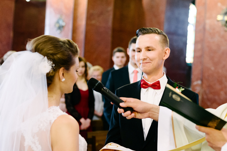 Wedding ceremony in catholic church. Marriage vow. Wedding dayの写真素材