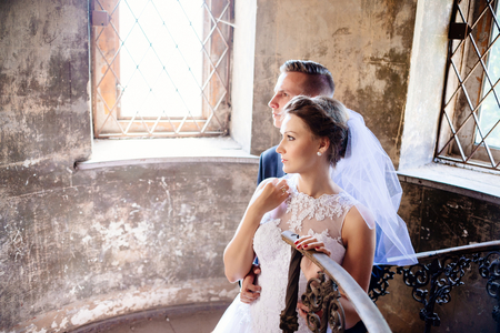 Newlyweds near old stairs . Wedding day. Wedding sessionの写真素材