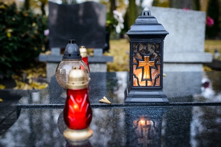 Candles burning at a cemetery during All Saints Day. 1st Novemberの写真素材