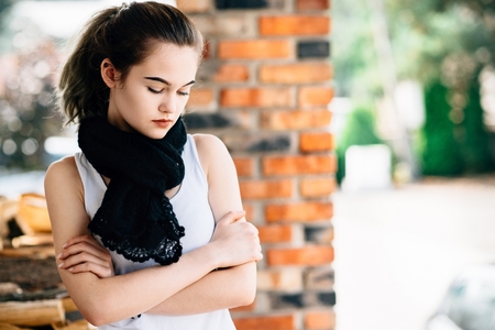 Portrait of thoughtful young teen girl on terraceの写真素材