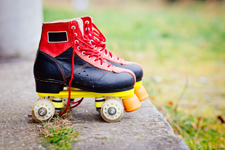 Old fashioned black and red roller skatesの写真素材