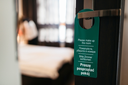 Door hanger please make up my room in 4 languages. Working hotel maid. MORE FROM THIS SERIES IN MY PORTFOLIOの写真素材