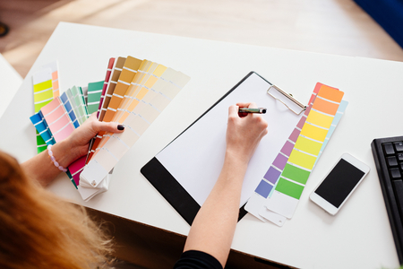 Woman designer or architect choosing color from color paletteの写真素材