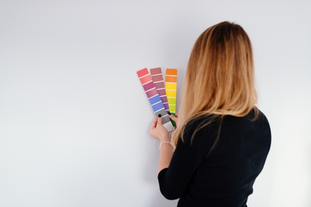 Woman designer or architect choosing wall color from color paletteの写真素材