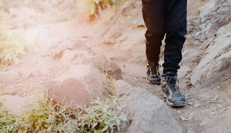 Close up on child trekking shoes on mountains trail. Mountain adventure. Masca Valley, Tenerife island, Canary Islands, Spainの写真素材
