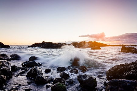 Sunset at rocky coast of Tenerife beach. Puerto de Santiago, Tenerife island, Canary Islands, Spainの写真素材