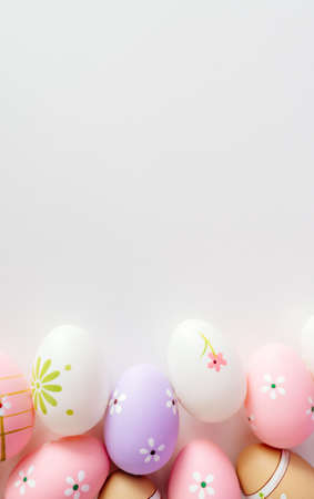 Colorful Easter eggs on white background with space for message. Happy Easterの写真素材