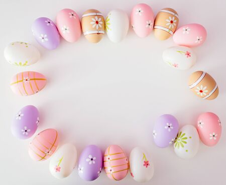 Colorful Easter eggs on white background with space for message. Happy Easter