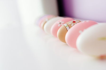 Colorful Easter eggs on white background with space for message. Happy Easter