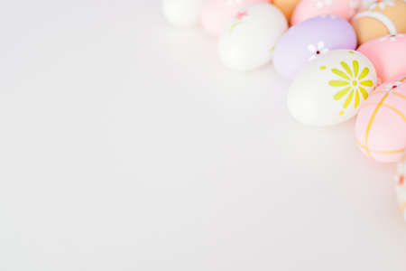 Colorful Easter eggs on white background with space for message. Happy Easterの写真素材