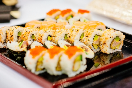 Pieces of fresh delicious Japanese sushi on trayの写真素材