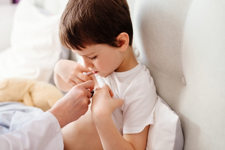 Little boy child is examining by a doctor with stethoscope. Sick childの写真素材