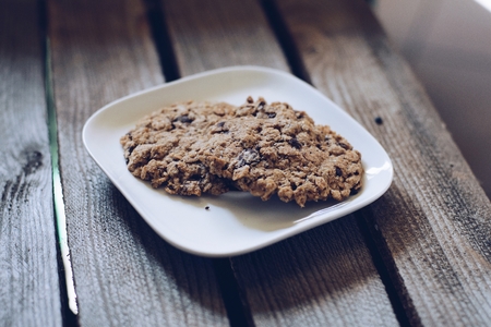 Delicious healthy oatmeal cookies on wooden tableの写真素材
