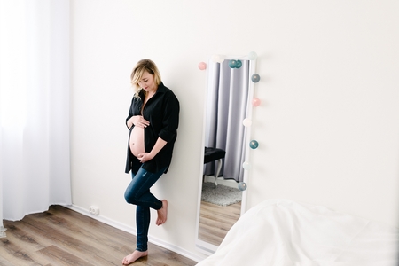 Pregnant woman in black shirt. Maternity conceptの写真素材