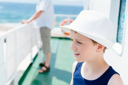 Little boy child in white hat on summer vacationsの写真素材