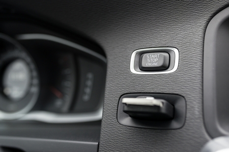 Close-up on automatic starter, start stop engine button in modern car