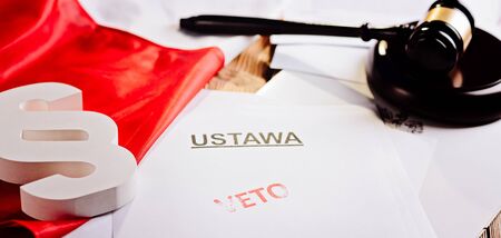 Red veto stamp on law act and Polish flag - law office conceptの写真素材