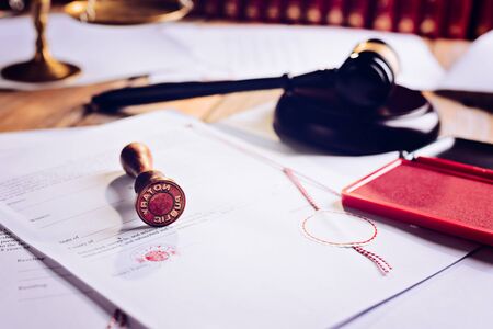 Notary public metal stamper on testament. Law officeの写真素材