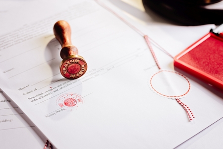 Notary public metal stamper on testament. Law officeの写真素材