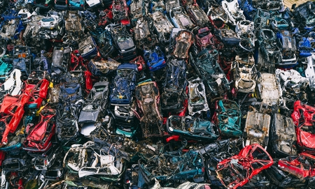 Destroyed scrapped cars stacked on a scrap yard. Car recyclingの写真素材