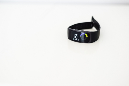 Fit band showing amount of burned calories. White backgroundの写真素材