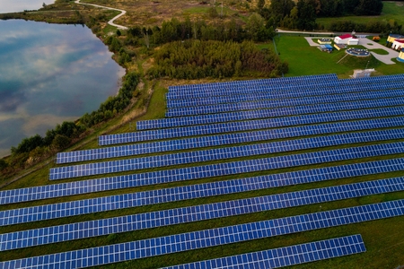 Aerial drone view on solar panels in green renewable energy solar farmの写真素材