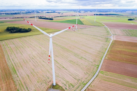 Aerial drone view on wind electricity generator. Green renewable energy