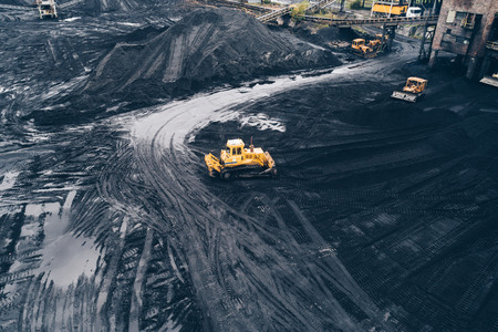 Aerial view of bulldozers in coal mine in Silesia, Polandの写真素材