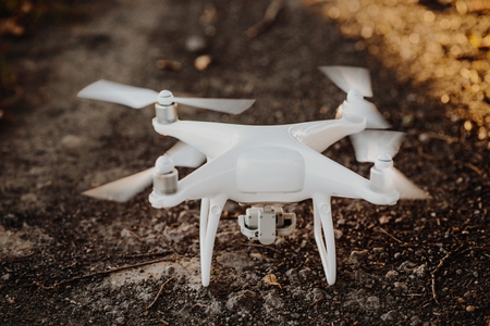 Starting white drone quadcopter with cameraの写真素材