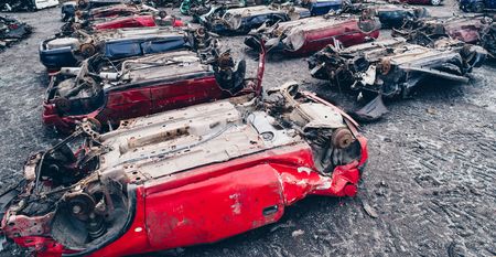 Car wreck on the roof in car scrapyard. Car recyclingの写真素材